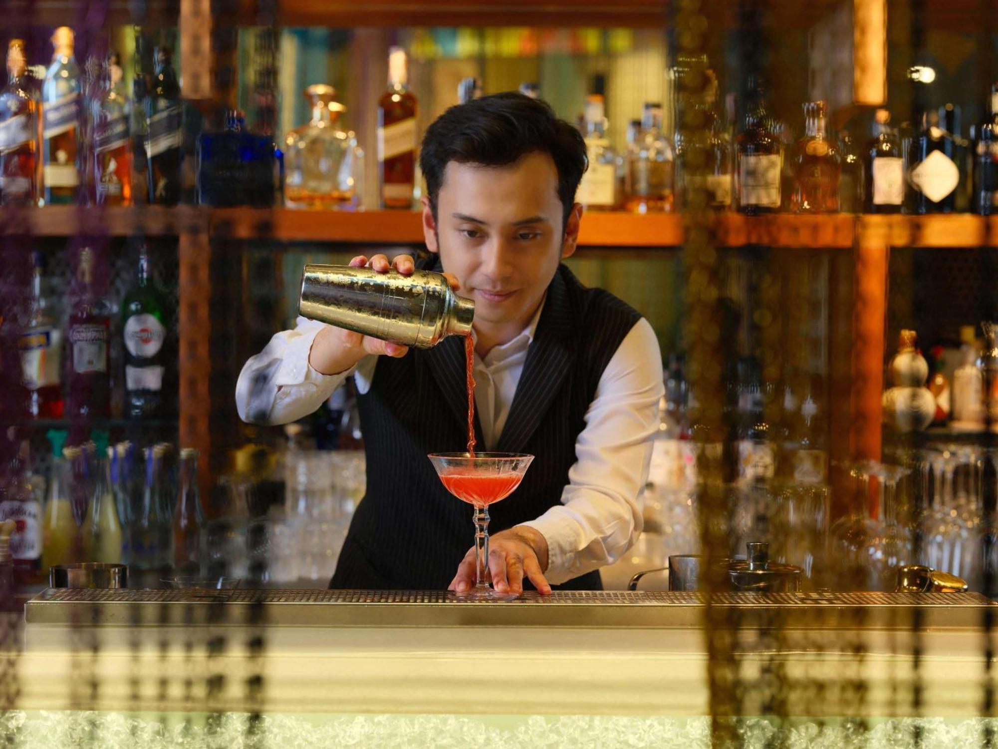 Pullman Jakarta Central Park Экстерьер фото A bartender at work